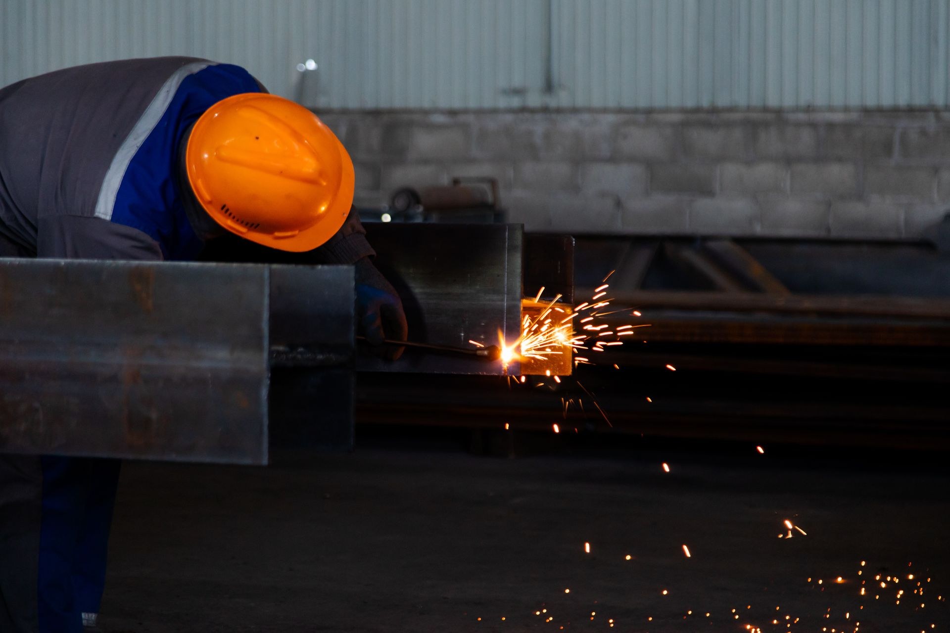 Industrial steelwork fabrication preceding protective coating application