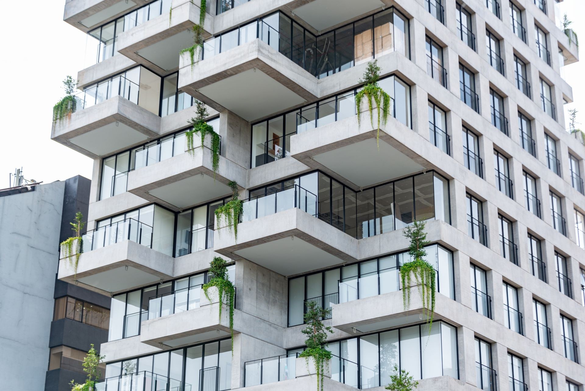 Contemporary residential building with geometric balconies maintained by Velion