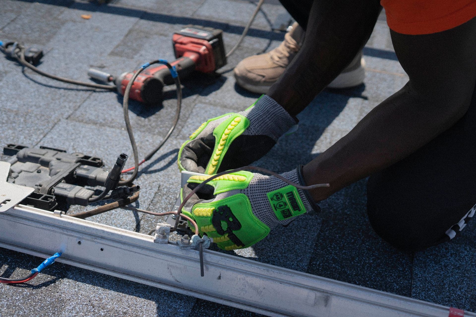 AC technician working on an air conditioning unit with proper tools