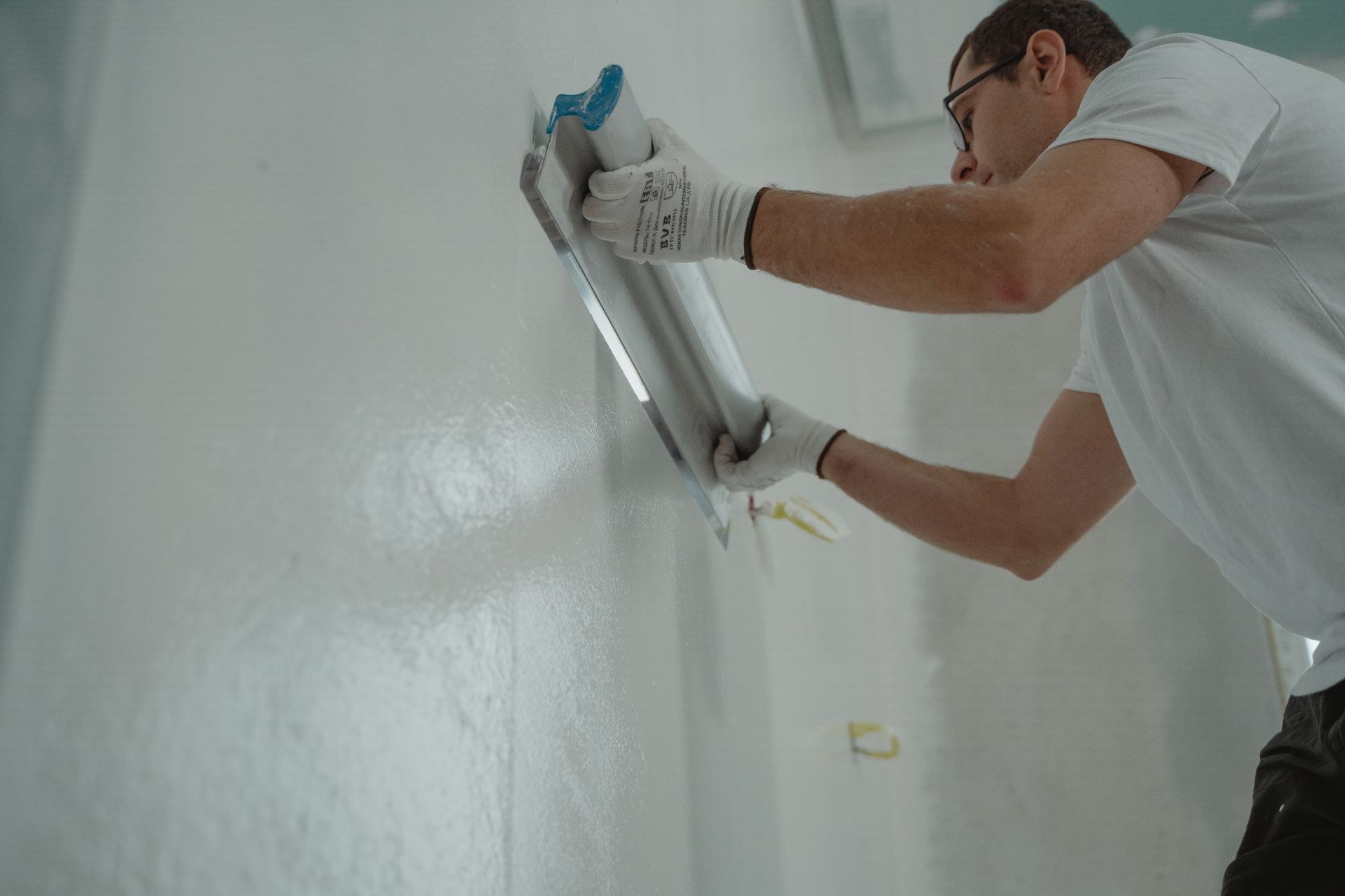 Demonstration image: an interior wall surface under preparation before painting