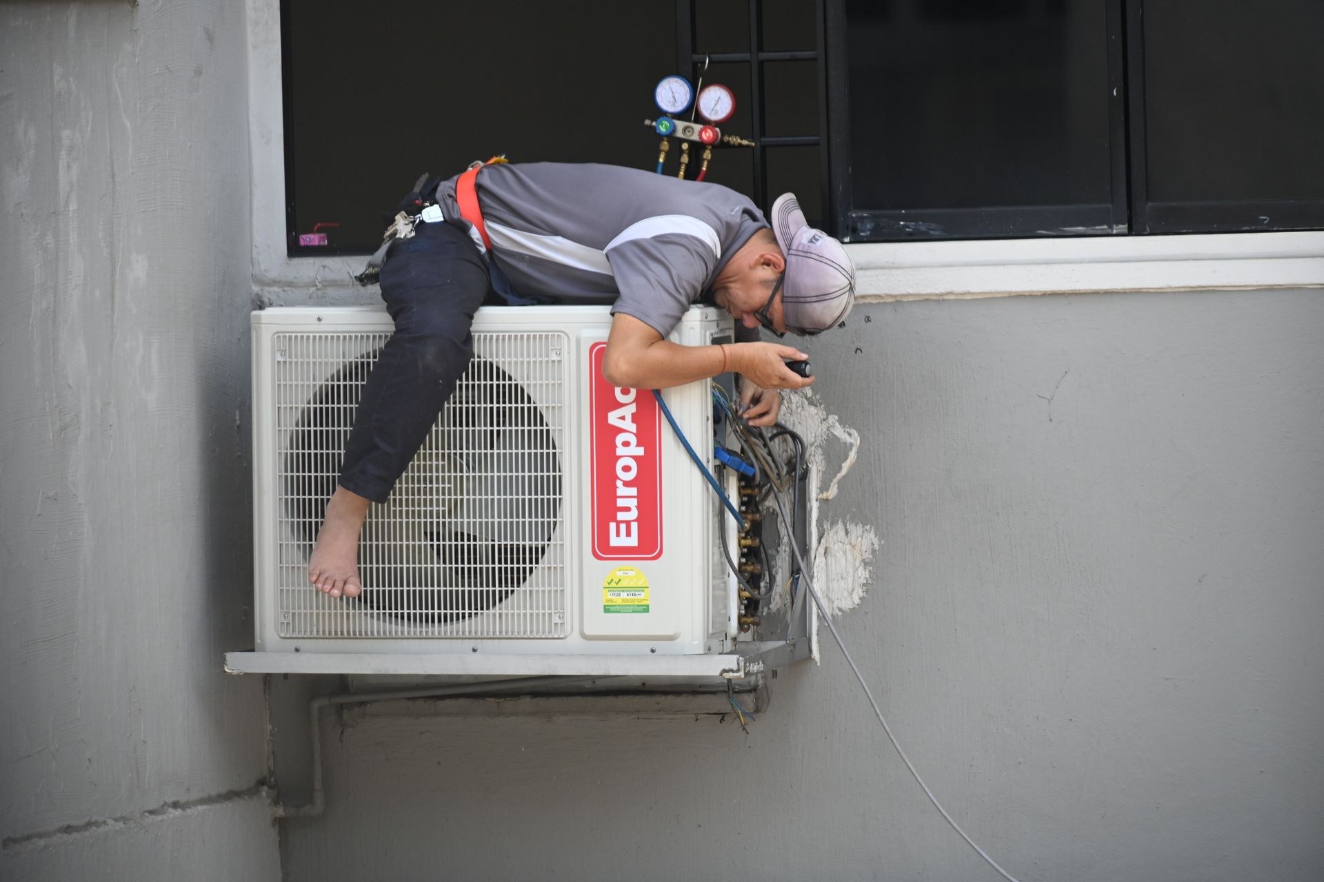 Wall mounted air conditioning unit on a concrete surface